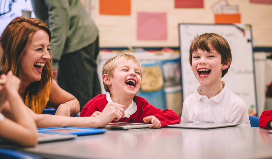 Children laughin in a classroom