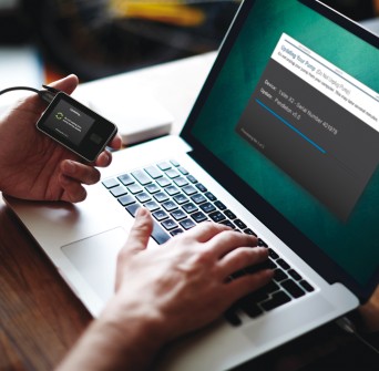 The t:slim X2 being updated by USB connection to a laptop